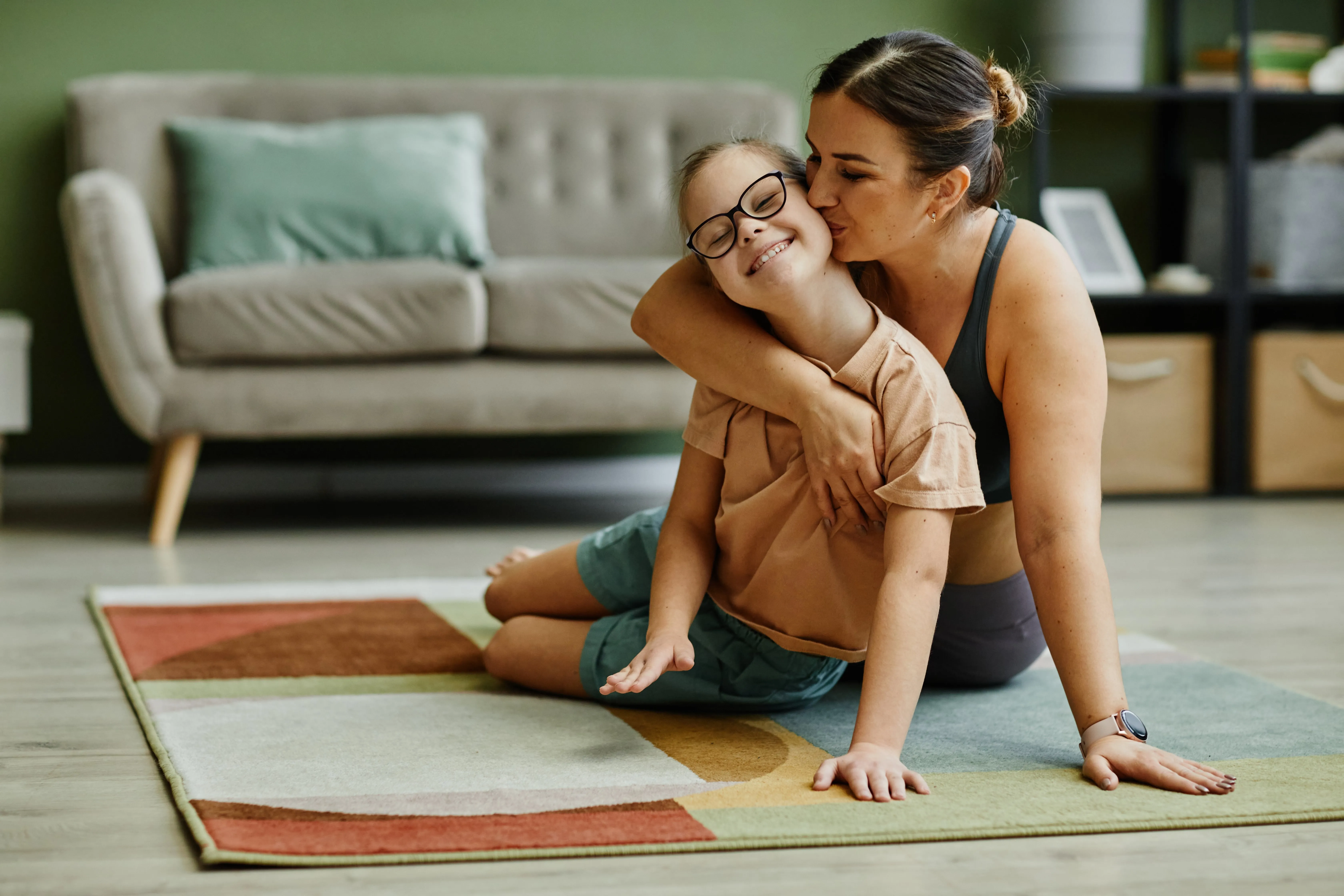 mother-kissing-girl-with-down-syndrome-2023-11-27-05-23-40-utc